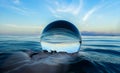 Ocean Surface Ripples and Clouds in Sky Captured in Glass Ball Royalty Free Stock Photo