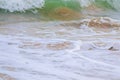 Ocean tides crashing and make white foam close to the beach Royalty Free Stock Photo