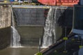 Water pouring over the lock gates as a ship heads out of the Miraflores Locks Panama Canal