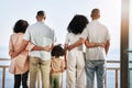 Ocean, travel and back of family on hotel balcony for vacation, weekend and holiday together. Travelling, love and Royalty Free Stock Photo