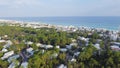 Ocean view beach community with row of white painted three-story vacation rental homes, condo buildings spanning 2 miles of sandy Royalty Free Stock Photo