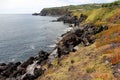 Ocean view from the cliff, volcanic rocks below, Cinco Ribeiras, Terceira, Azores, Portugal