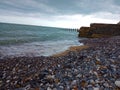 OCEAN VIEW SEA WATER SANDY STONE BEACH WALL WRECKAGE