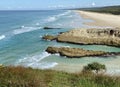 Ocean views over Main Beach, a surf beach on a tropical island paradise off Queensland, Australia Royalty Free Stock Photo