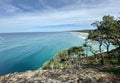 Ocean views and a surf beach taken from a rocky headland on a tropical island paradise off Queensland, Australia Royalty Free Stock Photo