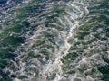 Ocean wake behind a big ferry ship boat