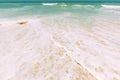 Ocean water foam splashes washing sandy beach. Amazing landscape scenery. Crashing waves of sandy coastline. Sea ocean Royalty Free Stock Photo