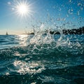 Ocean Water Splash with Bright Sunlight and Sailboat Royalty Free Stock Photo