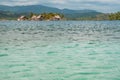 Ocean water texture closeup with island and wooden houses background - Guna Yala, San Blas Islands Royalty Free Stock Photo