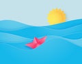 Ocean water wave with origami made sailing boat floating on the sea and sun paper cut style Royalty Free Stock Photo