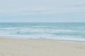 ocean waterfront beach on moody windy day in Portugal. Faded peaceful background