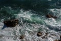 Ocean wave background breaking sea water rocky shore Royalty Free Stock Photo