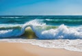 An ocean wave breaking on a sandy beach