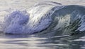 Ocean wave closeup detail of upright crashing hollow breaking water. energy power of nature. Royalty Free Stock Photo
