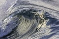 Ocean wave closeup detail of upright crashing hollow breaking water. energy power of nature.