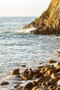 Ocean wave meeting cliff edge along rocky shoreline Royalty Free Stock Photo