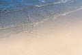 Ocean wave on tropical beach with golden sand and ripple of water splash. Royalty Free Stock Photo