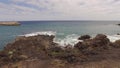 Ocean waves along a rocky coast. Cinematic drone shot Royalty Free Stock Photo