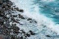 Ocean waves on black pebble stone beach Royalty Free Stock Photo