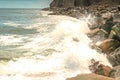 Ocean Waves breaking against rocky shoreline Royalty Free Stock Photo