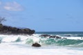 Ocean waves breaking along a rocky beach