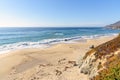 Ocean waves breaking on a deserted sandy beach Royalty Free Stock Photo