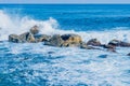 Ocean waves crashing against huge boulders Royalty Free Stock Photo