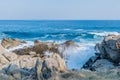 Ocean waves crashing against huge boulders Royalty Free Stock Photo