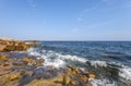 Ocean waves crashing against a rocky shore Royalty Free Stock Photo