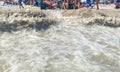 Ocean waves crashing into beach leaving a cliff Royalty Free Stock Photo