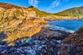 Ocean waves crashing into hidden tide pool on west coast