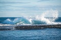 Ocean waves crashing on icebergs, black sand beach at Jokulsarlon, Iceland Royalty Free Stock Photo