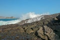 Ocean waves crashing on to lava rocks, Big Island of Lombok, Indonesia Royalty Free Stock Photo