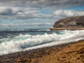 Ocean waves crushing on rough stone coast of rugged Irish coast line with cliffs. Kilkee area, Ireland. Popular travel and tourism Royalty Free Stock Photo