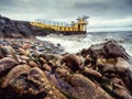 Ocean waves and rocks by Blackrock diving tower, Salthill area, Galway city, Ireland. Popular city landmark and tourist viewpoint