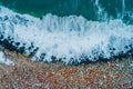 Ocean waves and rocky coast with stones, aerial top view Royalty Free Stock Photo