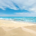 Ocean waves rolling on sandy beach under sky with clouds Royalty Free Stock Photo