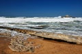 Ocean waves running on smooth rocks at the time of ebb. Royalty Free Stock Photo