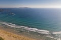 ocean waves, sandy beach with people bathing in the water, top view, Lanzada beach, Galicia, Spain Royalty Free Stock Photo