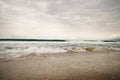 Ocean waves on Santa Monica beach in cloudy november day Royalty Free Stock Photo