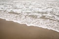 Ocean waves on Santa Monica beach in cloudy november day Royalty Free Stock Photo