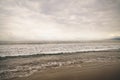 Ocean waves on Santa Monica beach in cloudy november day Royalty Free Stock Photo