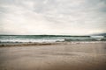 Ocean waves on Santa Monica beach in cloudy november day Royalty Free Stock Photo