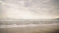 Ocean waves on Santa Monica beach in cloudy november day Royalty Free Stock Photo