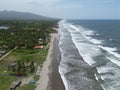 Ocean waves touching the coastline with the green beach view, Playa El Espino, Usulutan, El Salvador