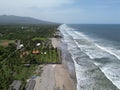 Ocean waves touching the coastline with the green beach view, Playa El Espino, Usulutan, El Salvador