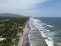 Ocean waves touching the coastline with the green field view, Playa El Espino, Usulutan, El Salvador
