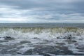 Oceanic waves during storm. Water roll forward and boils at shore, force of nature and beatyful powder blue ,aquamarine