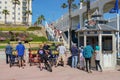 The Oceanside boardwalk next the pier, a concrete walkway shared by walkers and bicyclists.