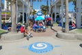 The Oceanside boardwalk next the pier, a concrete walkway shared by walkers and bicyclists.